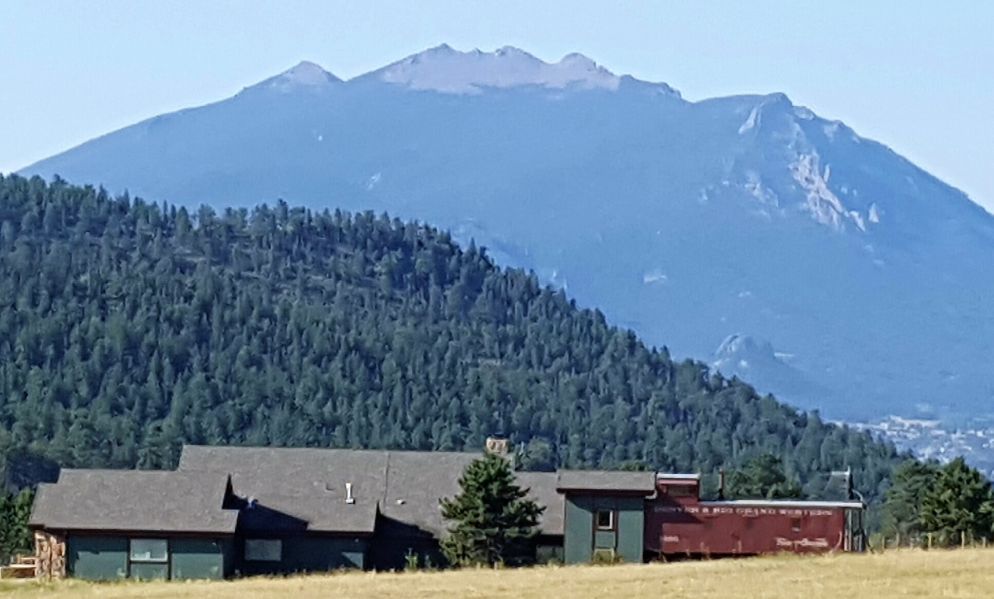 Railroad car attached to house, Estes Park