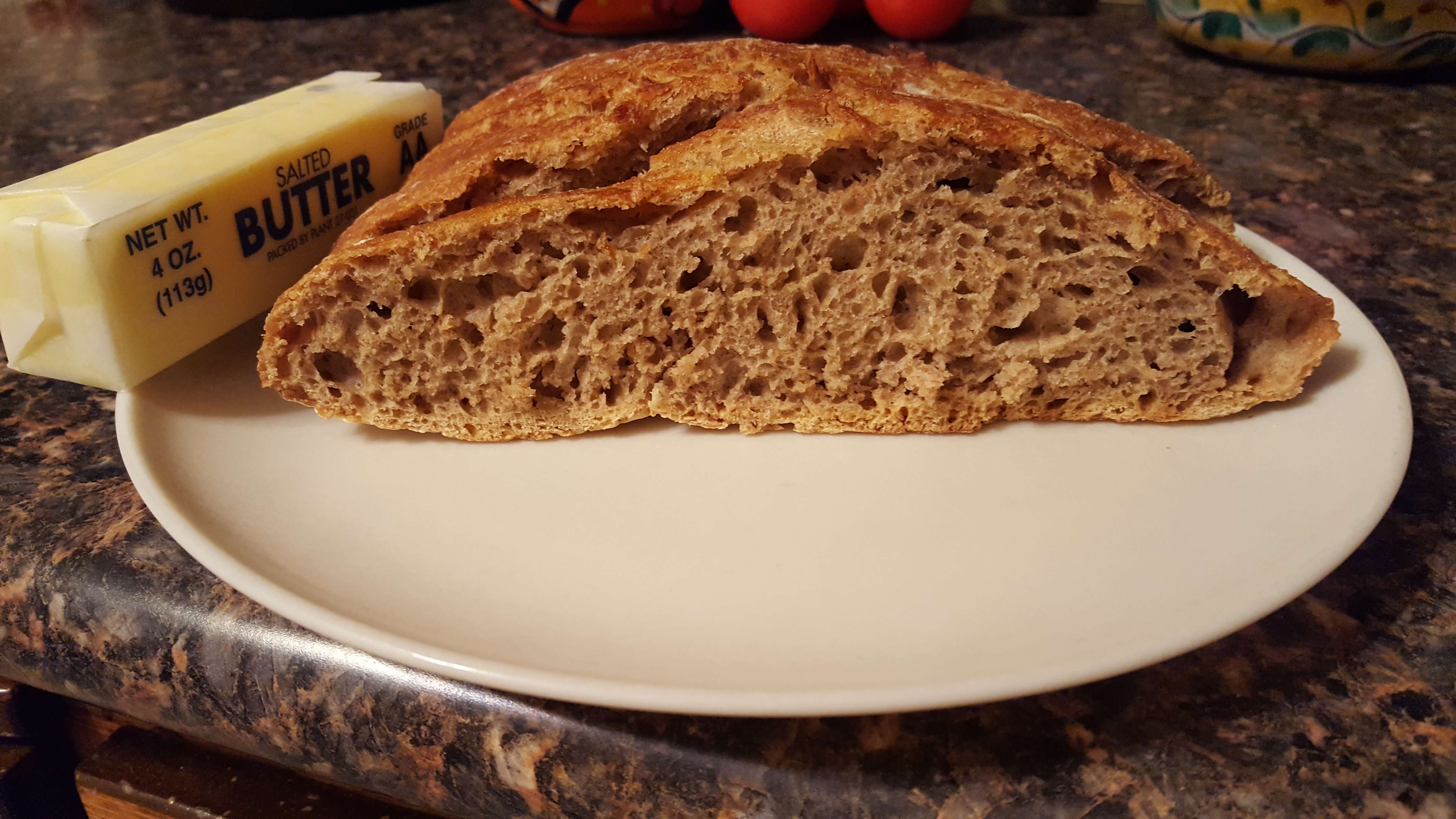 Homemade crusty bread with lots of butter