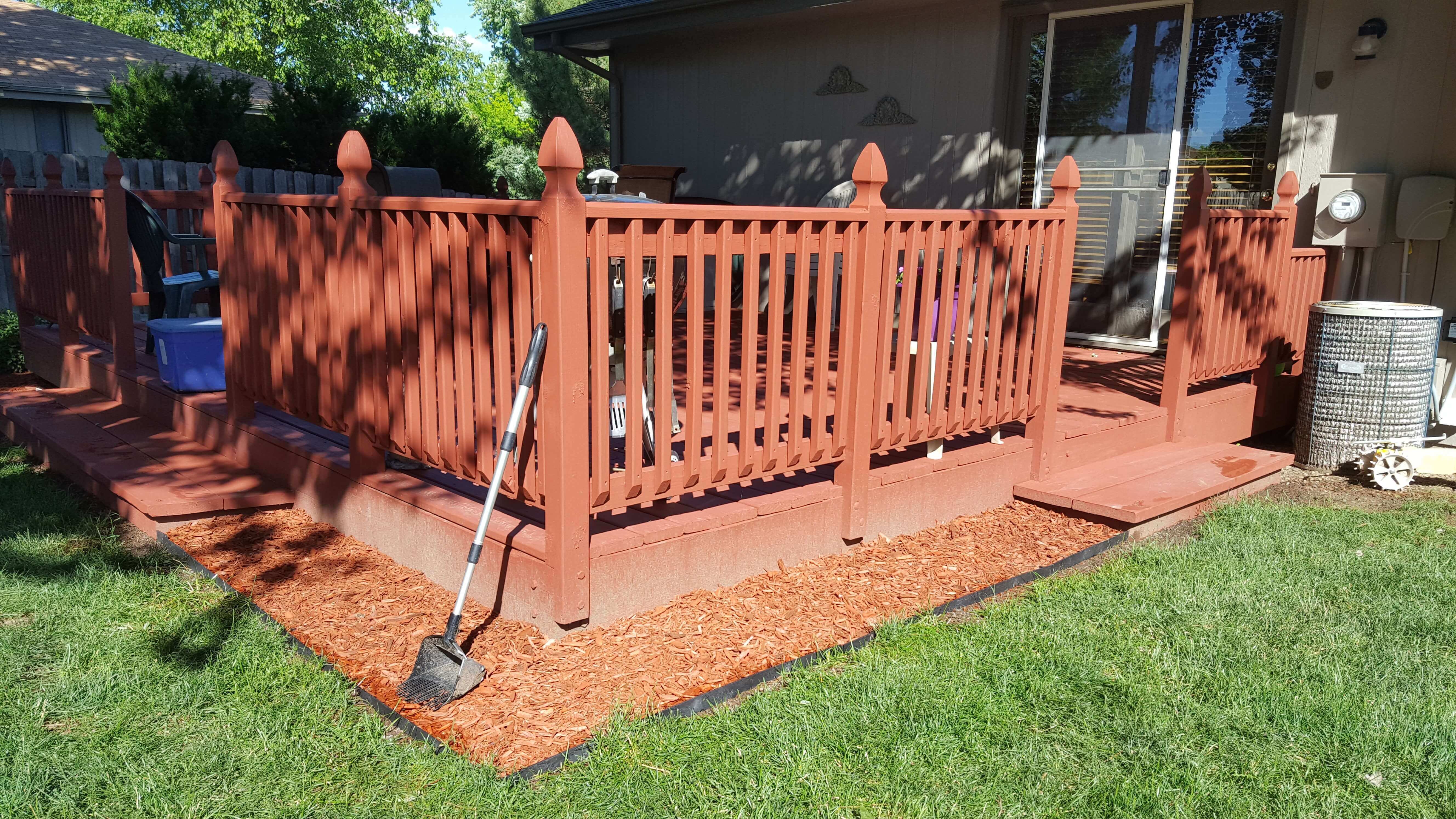 Red mulch around a red deck