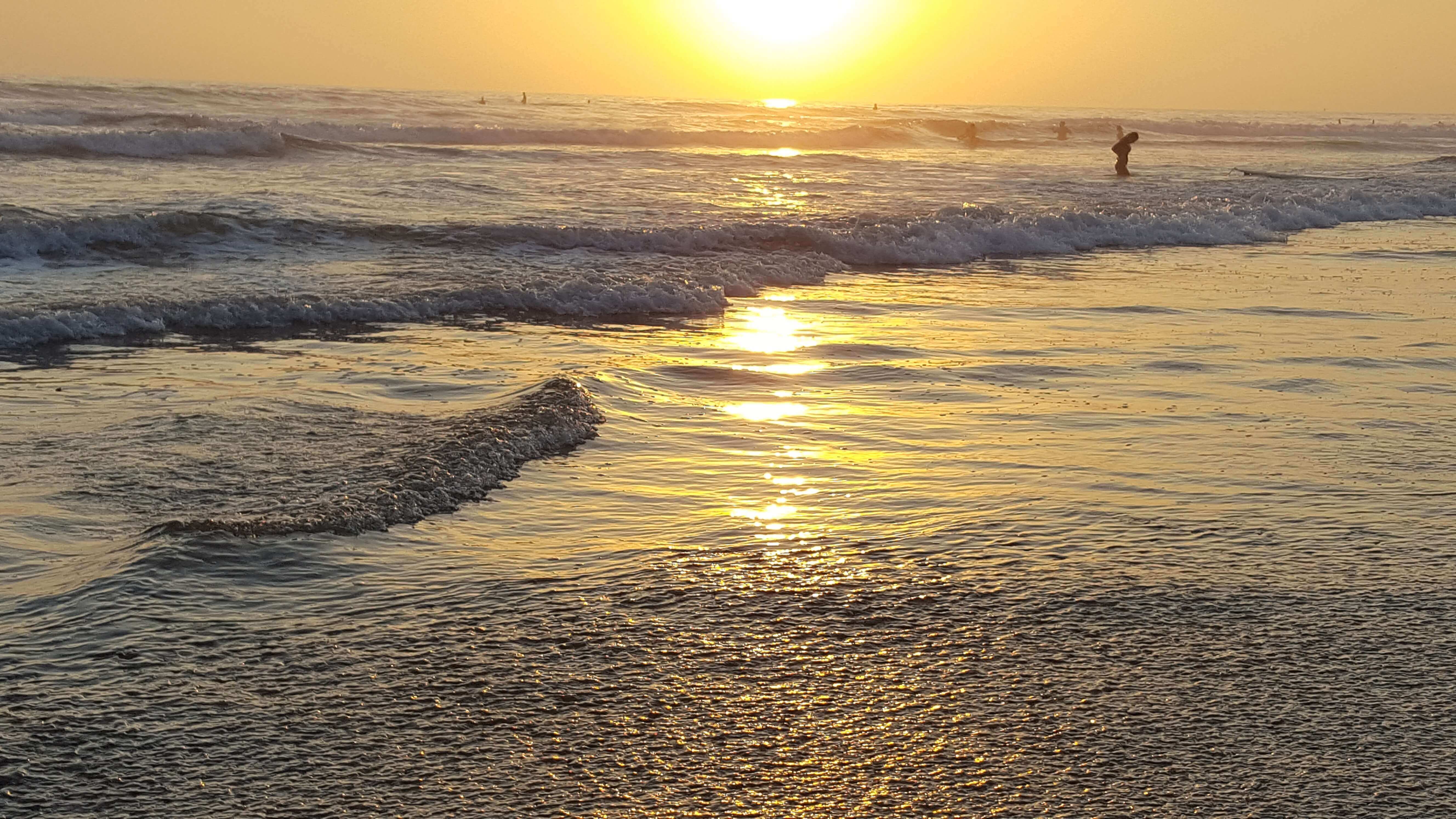 Golden waves of Pacific Ocean near Oceanside Pier