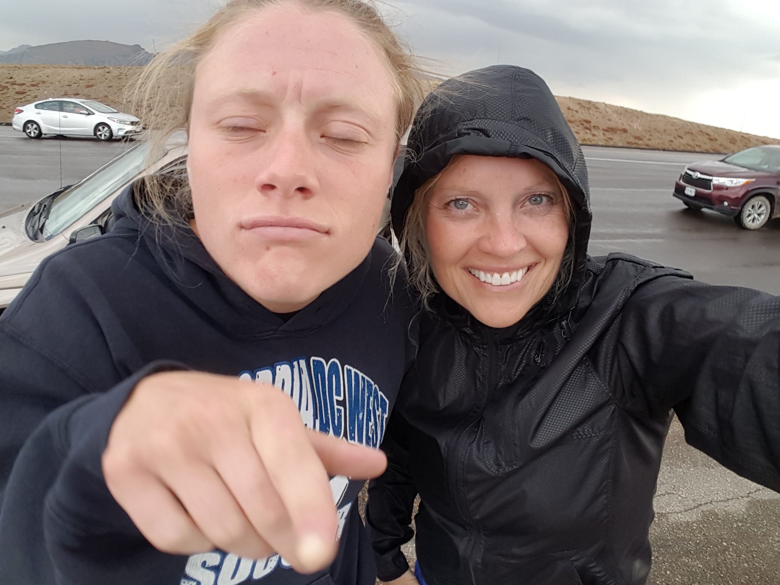 Kid making fun of parent trying to do a selfie